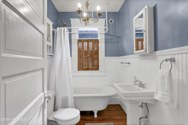 bathroom with shower / bathtub combination with curtain, toilet, a chandelier, and hardwood / wood-style floors