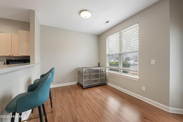 office with light hardwood / wood-style flooring