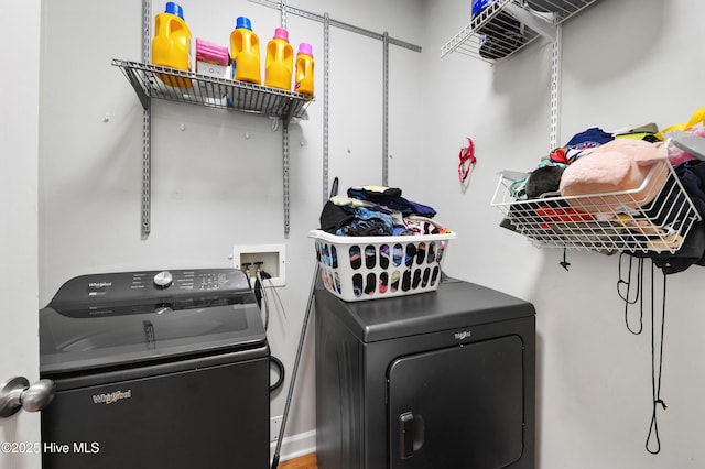 laundry room featuring washing machine and clothes dryer