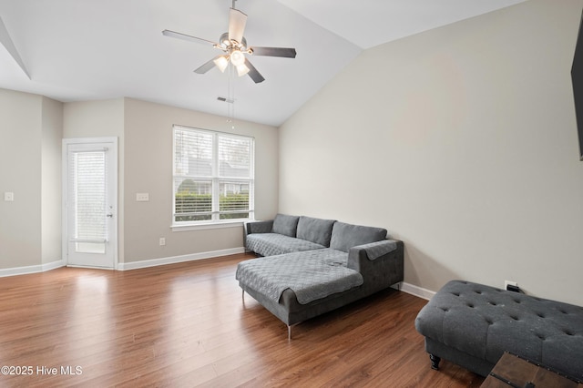 living room with wood-type flooring, vaulted ceiling, and ceiling fan