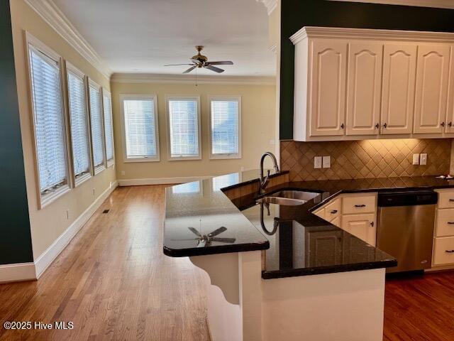 foyer featuring an inviting chandelier, crown molding, and wood-type flooring