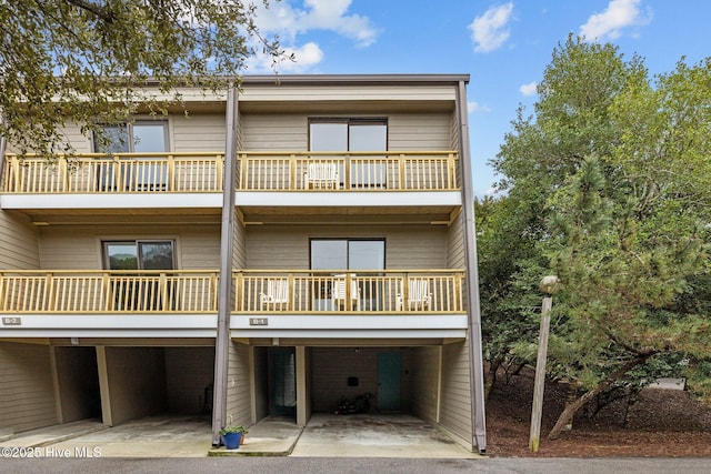 back of property featuring a balcony