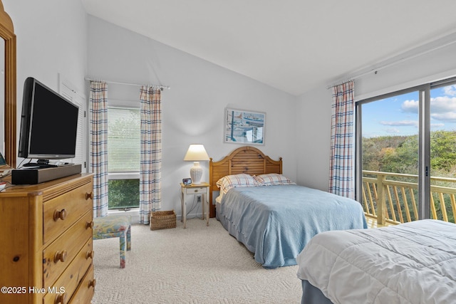 bedroom with multiple windows, lofted ceiling, access to outside, and carpet