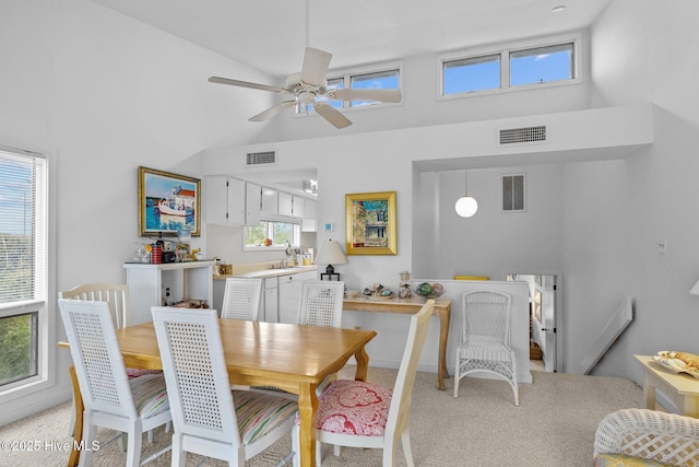 dining space featuring vaulted ceiling and ceiling fan