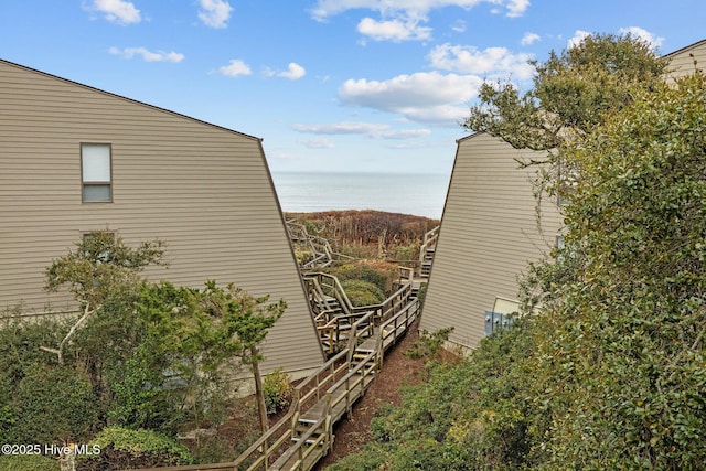 view of side of home with a water view