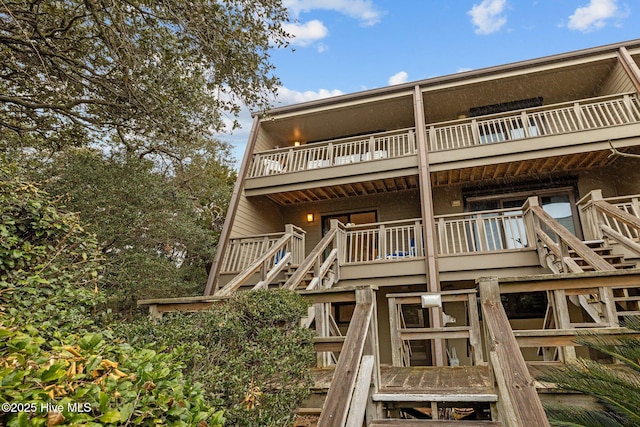 rear view of property with a balcony