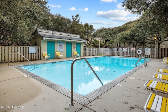 view of swimming pool with a patio area