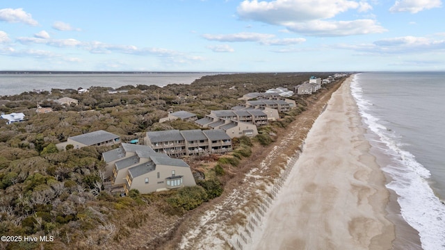 bird's eye view featuring a beach view and a water view