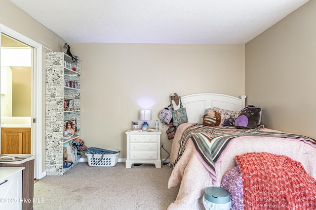 carpeted bedroom featuring a textured ceiling