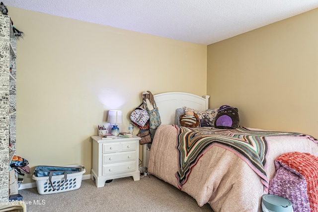 carpeted bedroom with a textured ceiling