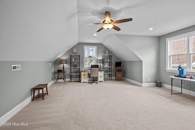 carpeted office featuring lofted ceiling and ceiling fan