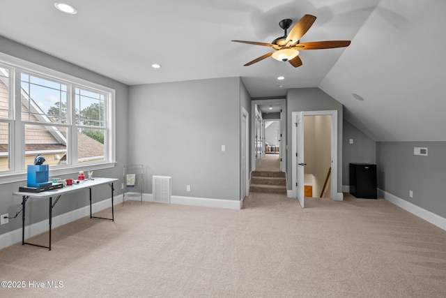 interior space with lofted ceiling and ceiling fan