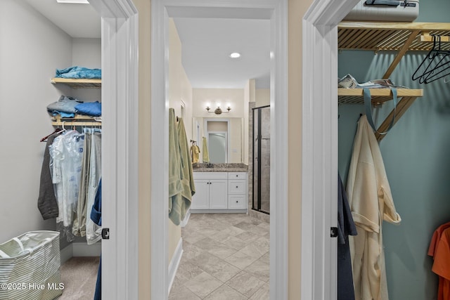 bathroom with vanity and an enclosed shower