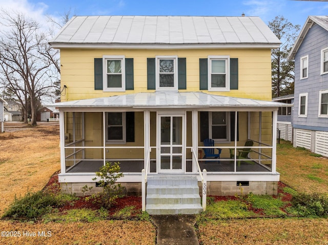 view of front of home featuring a sunroom