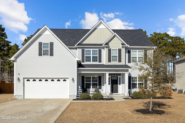 view of front facade with a garage and covered porch