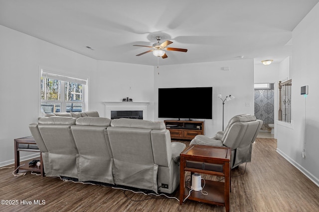 living room featuring hardwood / wood-style flooring and ceiling fan