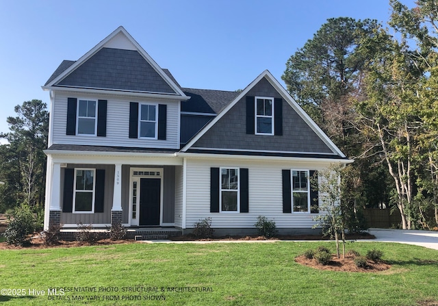 craftsman-style home with a front yard