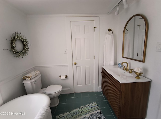 550 E Main St, Belhaven, NC 27810 - full bathroom featuring tile patterned flooring, rail lighting, toilet, vanity, and a freestanding tub