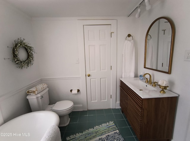 bathroom with vanity, track lighting, tile patterned floors, and toilet