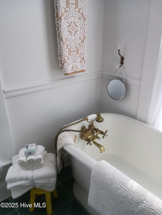 bathroom featuring tile patterned flooring and a tub