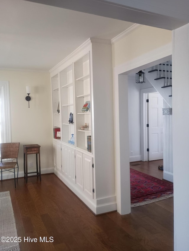 corridor featuring crown molding and dark hardwood / wood-style floors