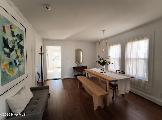 dining area featuring crown molding and dark hardwood / wood-style flooring