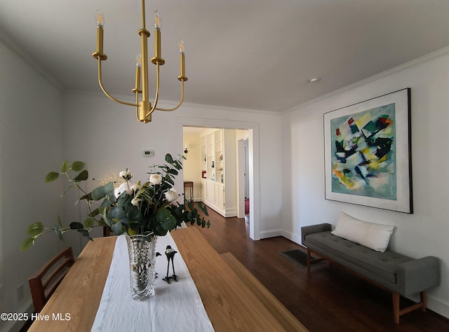 dining area with dark wood-type flooring and ornamental molding