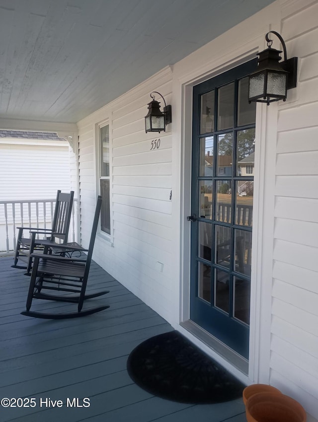 property entrance with covered porch