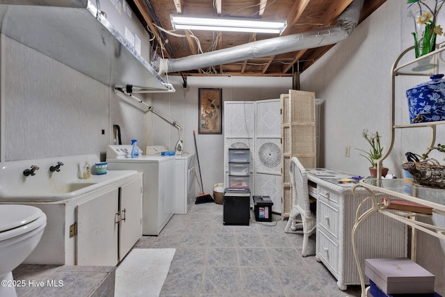 laundry room featuring sink and washer and dryer