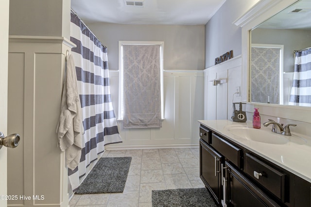 bathroom with vanity and walk in shower