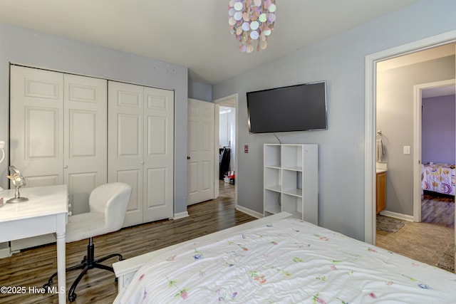 bedroom with a closet, lofted ceiling, and dark hardwood / wood-style floors