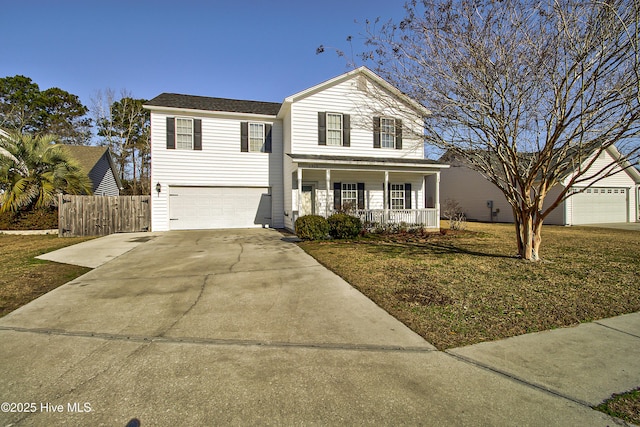 view of property with covered porch, a front lawn, and a garage