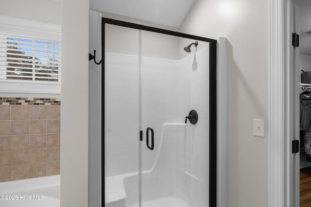 bathroom with a shower with shower door