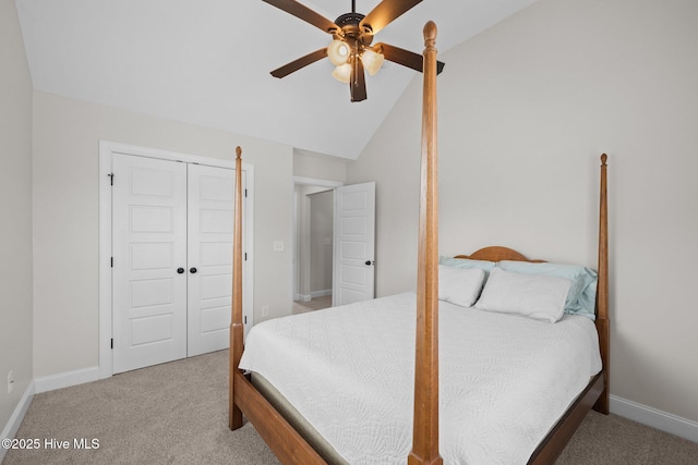 bedroom with vaulted ceiling, carpet flooring, ceiling fan, and a closet