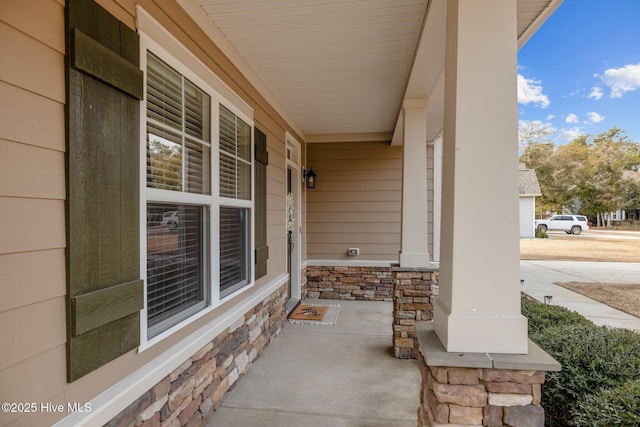 property entrance featuring covered porch