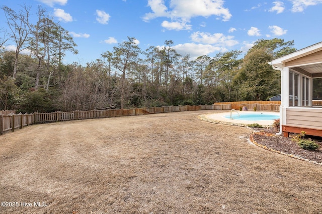 view of yard featuring a fenced in pool