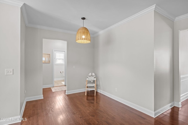 unfurnished room featuring crown molding and dark hardwood / wood-style flooring