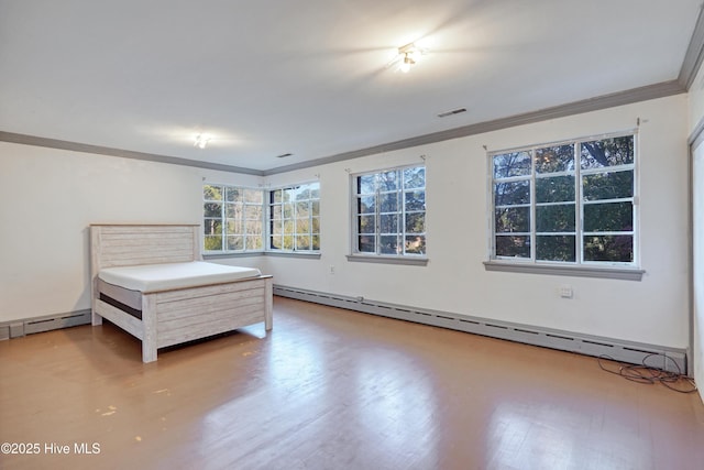 unfurnished bedroom featuring ornamental molding, baseboard heating, and light hardwood / wood-style floors