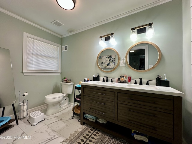 bathroom with ornamental molding, vanity, and toilet