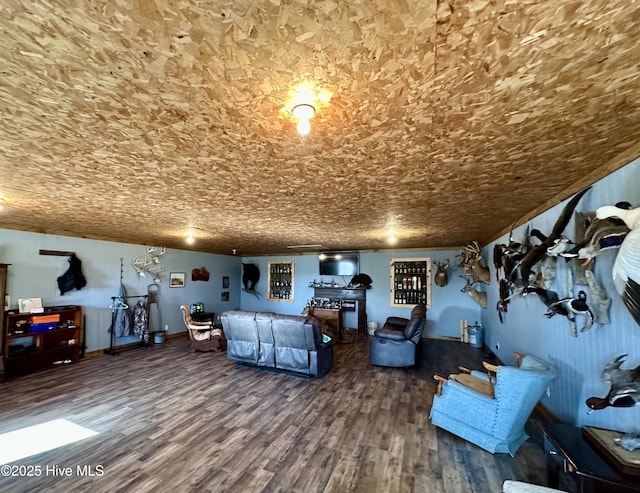 unfurnished living room featuring crown molding and hardwood / wood-style floors