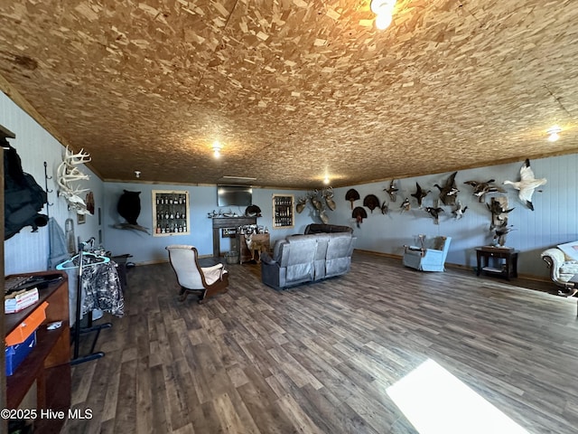 unfurnished living room with crown molding and hardwood / wood-style floors