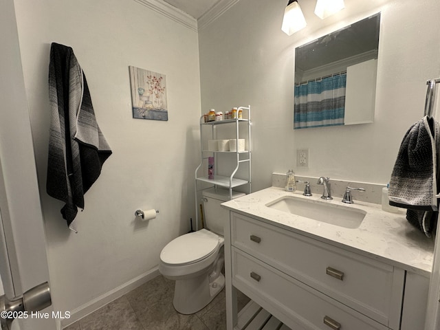 bathroom with baseboards, toilet, ornamental molding, tile patterned floors, and vanity