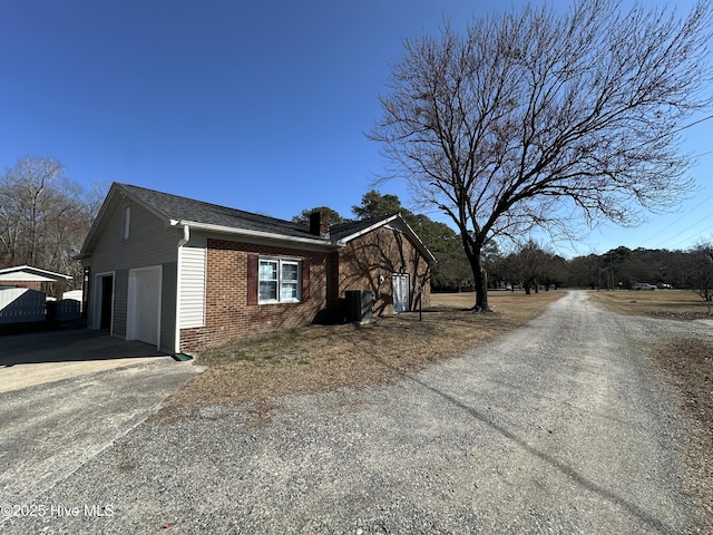 view of property exterior featuring brick siding