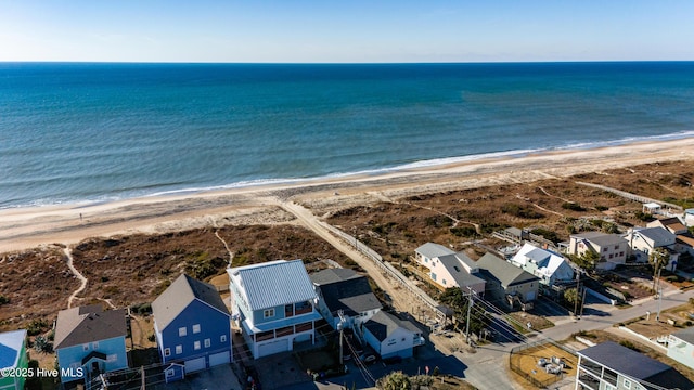 aerial view featuring a water view and a view of the beach