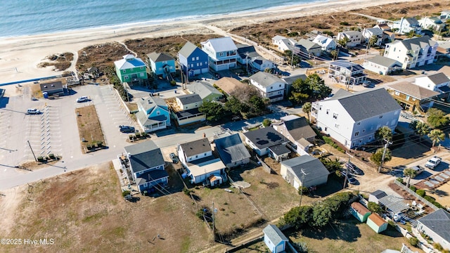 bird's eye view with a view of the beach and a water view