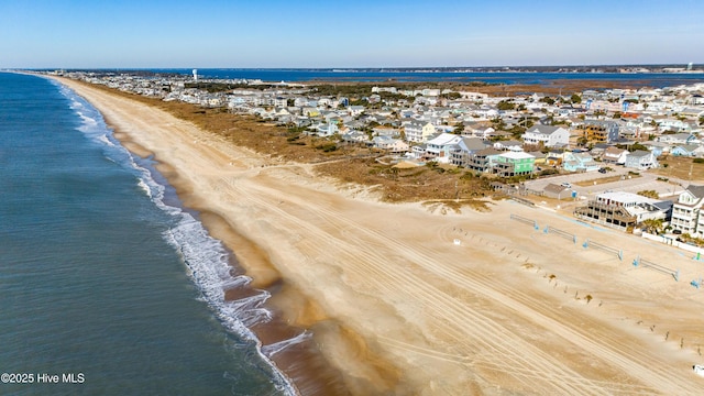 bird's eye view with a view of the beach and a water view