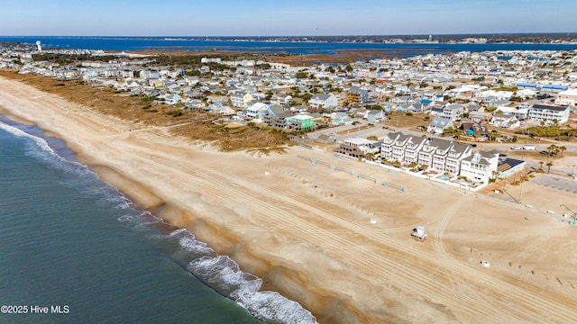 aerial view with a view of the beach and a water view