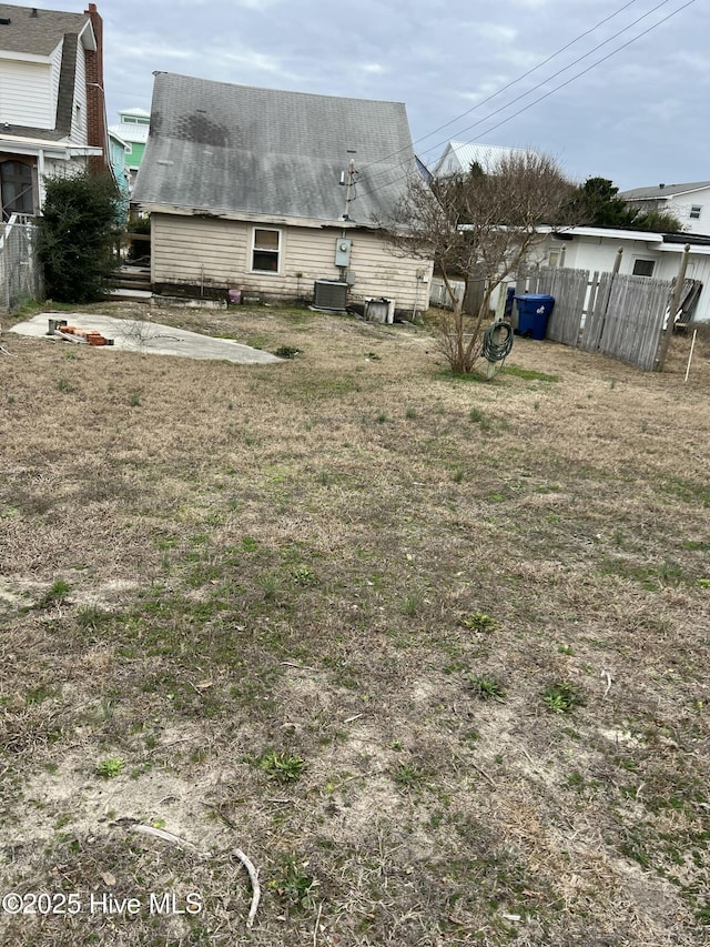 view of yard featuring central air condition unit