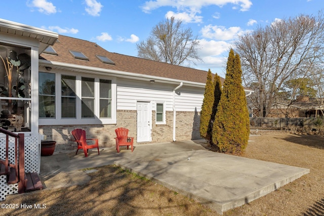 back of property featuring a patio