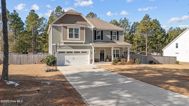 view of property featuring a garage and a porch